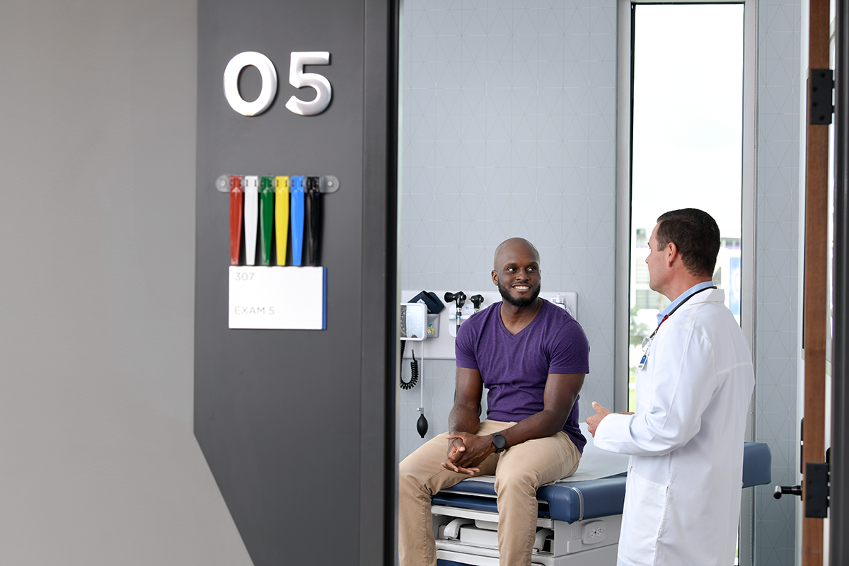 A healthcare worker in a surgical gown and glasses. A healthcare worker in a surgical gown and glasses.